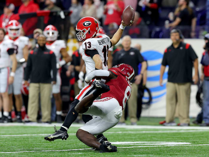 Stetson Bennett fumbles the ball as he's hit